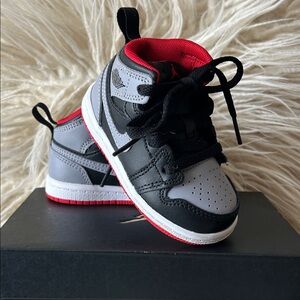 Jordan Kids Black and Gray Sneakers with Red Accents
